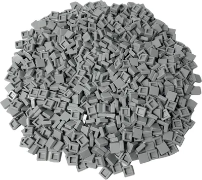 A pile of small, square, light gray LEGO tiles.