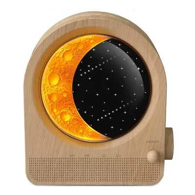 A wooden alarm clock with a moon and stars display.