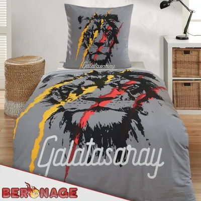A bedding set with a lion graphic and the Galatasaray logo is displayed on a bed.