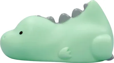 A light green dinosaur-shaped night light with gray spikes on its back.