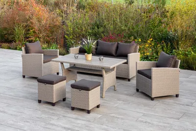 An outdoor patio setting with a rattan furniture set.