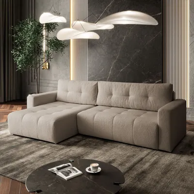 A modern living room with a sectional sofa, coffee table, and decorative lighting.
