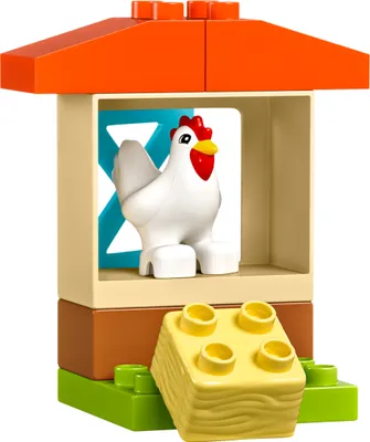 A LEGO DUPLO chicken coop with a chicken inside.
