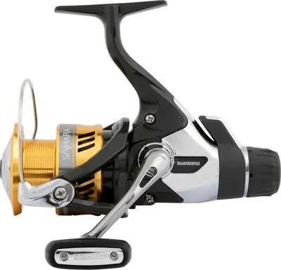 A studio shot of a fishing reel against a white background.