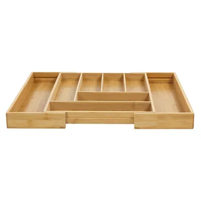 An empty bamboo cutlery organizer with multiple compartments, shown from a slightly elevated front-facing angle.