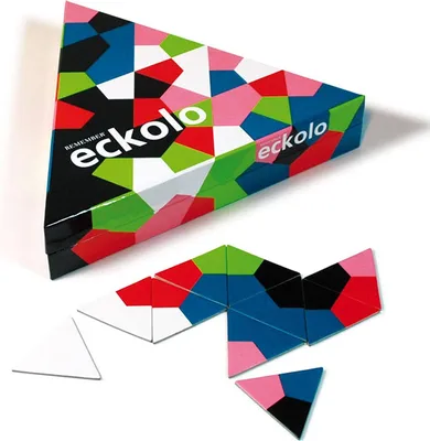 A triangular box and scattered puzzle pieces of the game Eckolo.