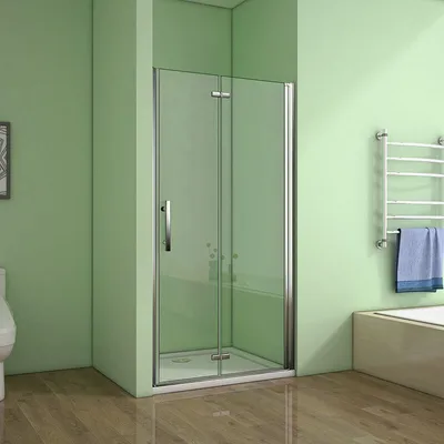 A modern bathroom with a glass shower enclosure, a towel rack with towels, and a toilet.