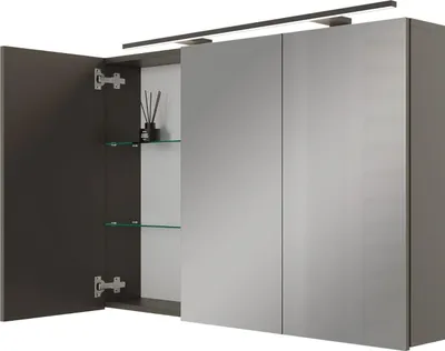A modern bathroom medicine cabinet with mirrored doors and an integrated light.
