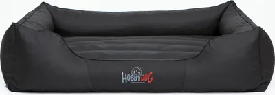 A black dog bed is shown against a white background.