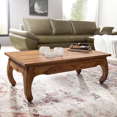 A living room scene with a coffee table and sofa.