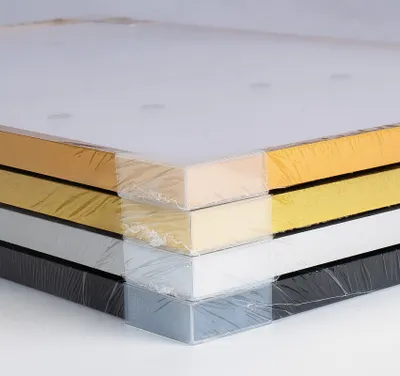A stack of six picture frames in different colors, wrapped in clear plastic.
