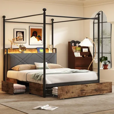 A bedroom scene featuring a canopy bed with storage drawers, bedside table, and artwork.
