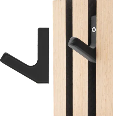 Two black hooks are shown. One is detached on a white background, and the other is attached to a wooden panel with black vertical stripes.