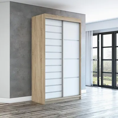 A modern sliding door wardrobe in a room with a concrete wall and wooden floor.