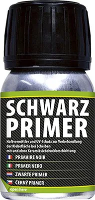 A bottle of black primer with text labels.