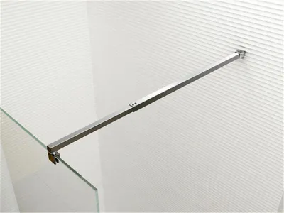 A shower screen support arm attached to a wall and a glass panel.