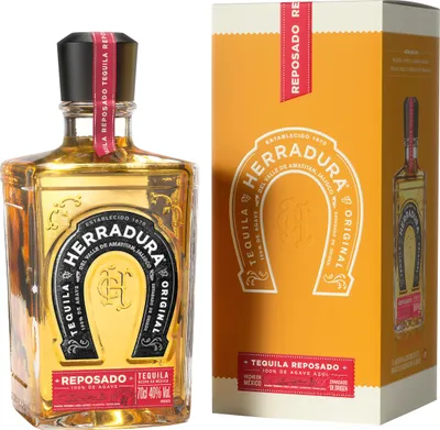 A bottle of Herradura Reposado Tequila and its packaging are displayed side-by-side against a white background.