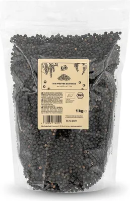 A bag of whole black peppercorns with a label.