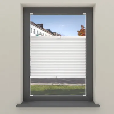 A window with white pleated blinds partially covering the view of houses and a street.