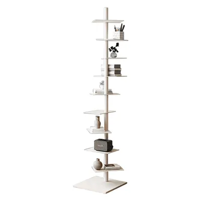 A tall, slender, white bookshelf with multiple staggered shelves, each holding a few decorative items or books.