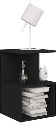 A black bedside table with a lamp, a decorative bottle, and a clock on top, and books inside.