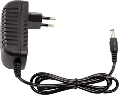 A black power adapter with a European plug and a DC barrel connector.