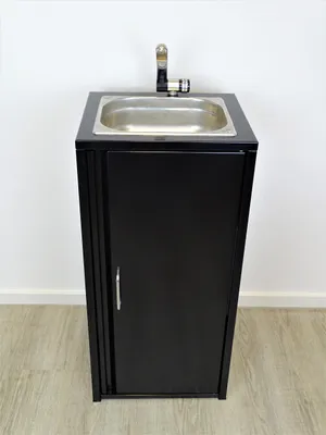A black mobile sink unit with a silver faucet and sink basin is shown against a white wall and light wood floor.