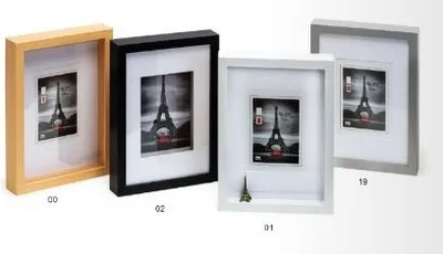Four picture frames with Eiffel Tower images inside, arranged diagonally.