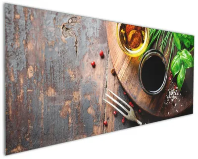 Produktbild von Wallario Küchenrückwand aus Glas, Größe: 125 x 50 cm, Motiv: Kräuter, Öle und Gewürze auf einem Holzbrett | Spritzschutz | abwischbar | pflegeleicht | in
