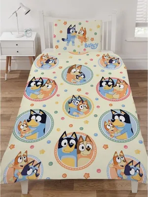 A Bluey themed duvet cover and pillowcase set displayed on a child's bed.