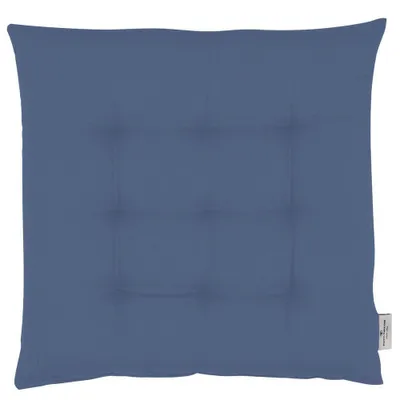 A plain blue cushion with tufting.