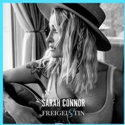 A black and white lifestyle shot of a woman wearing a hat and looking away from the camera. Text overlays indicate the artist and album title.