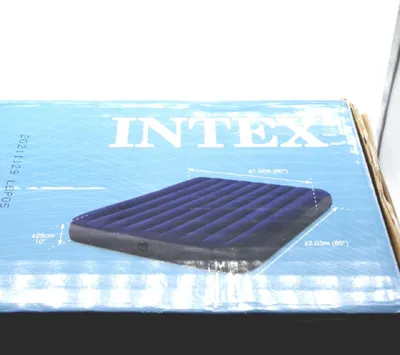 The image shows the packaging of an Intex air mattress, with a graphic of the mattress itself and some dimensions indicated.