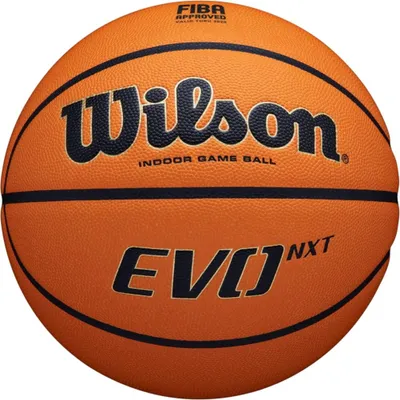 A close-up view of an orange basketball with black lines and text.