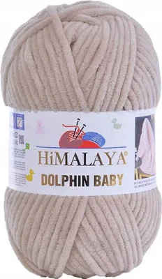 A ball of beige yarn on a white background.