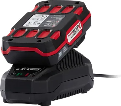 A black and red battery charger with a battery pack on top, shown against a white background.