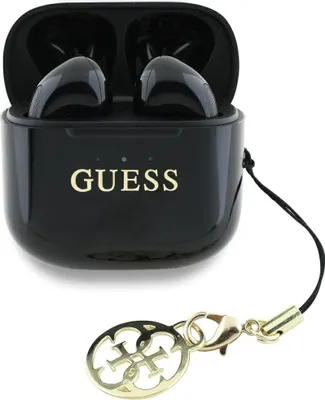 A black charging case for wireless earbuds with the Guess logo and a gold charm attached.