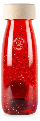 Zdjęcie produktu dla Pływająca butelka sensoryczna – 14 x 4 cm – czerwona | marki Petit Boum
