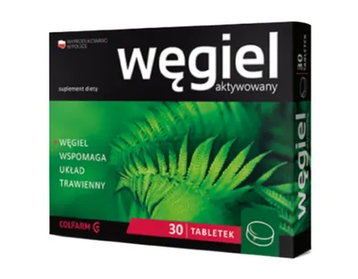 A product box for activated charcoal tablets, featuring a fern leaf image.