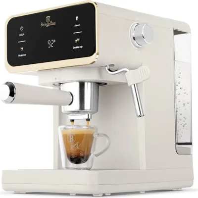 A close-up shot of a cream-colored espresso machine brewing coffee into a glass cup.