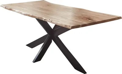 A dining table with a live edge wooden top and a black spider leg metal base, shown from a three-quarter angle against a white background.