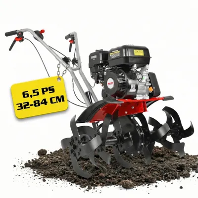 A rototiller is shown in a studio-like setting with a white background and a pile of soil in the foreground.