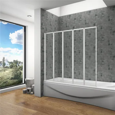 A modern bathroom with a bathtub and a folding shower screen, overlooking a scenic view.