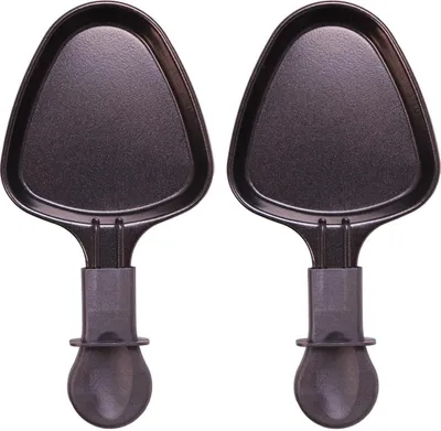 Two black raclette pans with gray handles are shown against a white background.