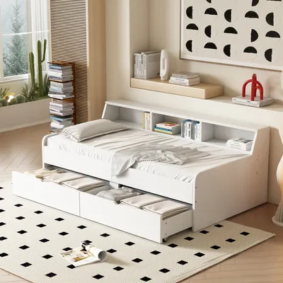 A white daybed with storage drawers and shelves in a bright room.