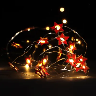 Produktbild von com-four® LED Lichterkette mit Timer - energiesparende Weihnachtsbeleuchtung - Lichterkette mit 20 LED-Sterne aus Holz - Weihnachtdekoration für Innen