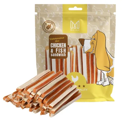 A bag of dog treats with some treats spilled in front.