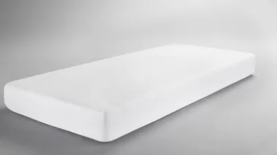 A white mattress on a light gray background.