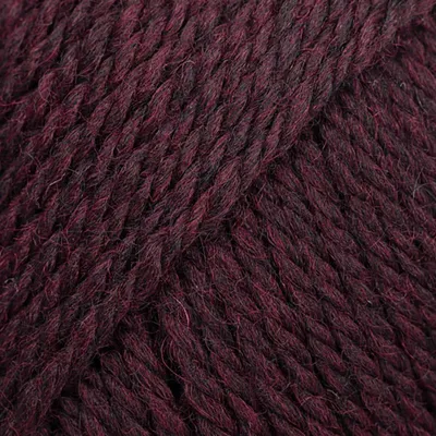 A close-up, textured view of dark burgundy and black yarn.