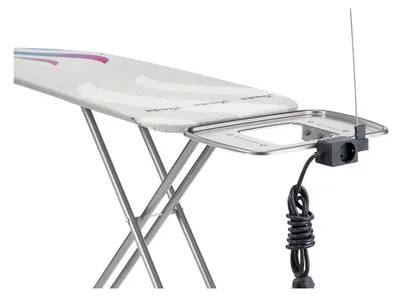 A close-up view of an ironing board with an attached electrical outlet and cord.